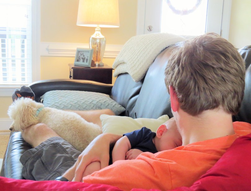 Malachi snuggling with Daddy & Teddy.