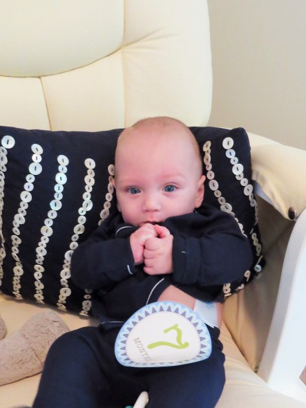 Malachi at 7 months old (3 months corrected)...not digging the whole picture taking thing. I think he was trying to eat his shirt.